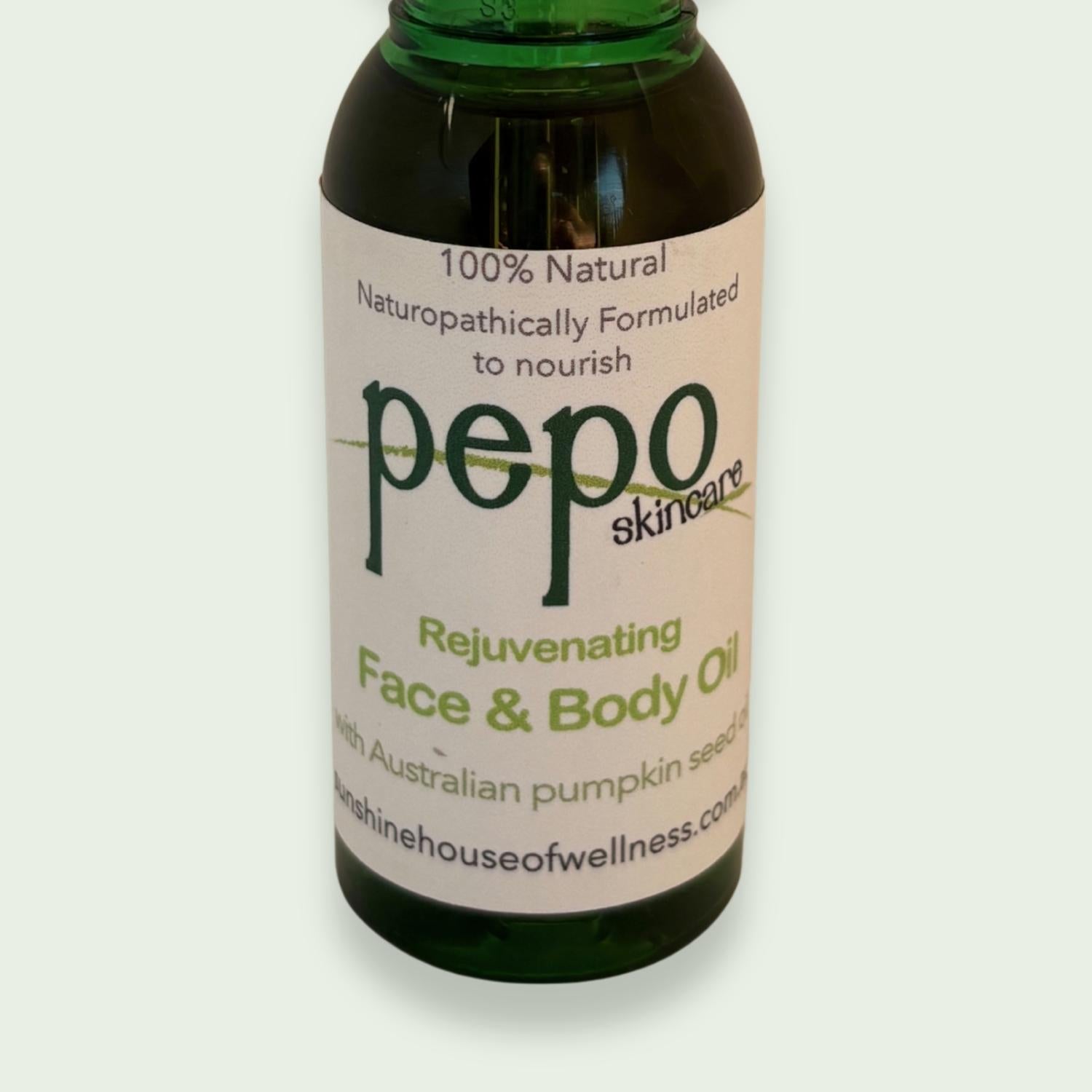 Bottle of pepo skincare rejuvenating face and body oil ,with pumpkin seed oil as hero ingredient, on a light gray background