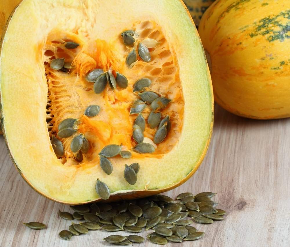 Half a Styrian pumpkin with dark green seeds used in naturopath-formulated Pepo natural Skincare by Sunshine House of Wellness.