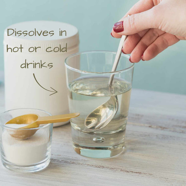 Person stirring a glass of collagen peptides with a spoon, next to a container labeled 'Dissolves in hot or cold drinks'.