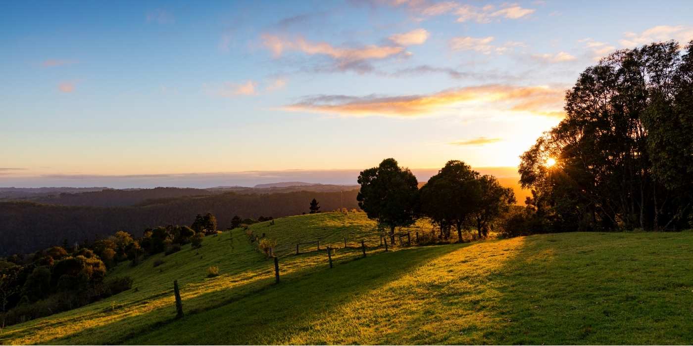 Naturopath services at Belli Park as the sun sets over farmland on the Sunshine Coast Hinterland